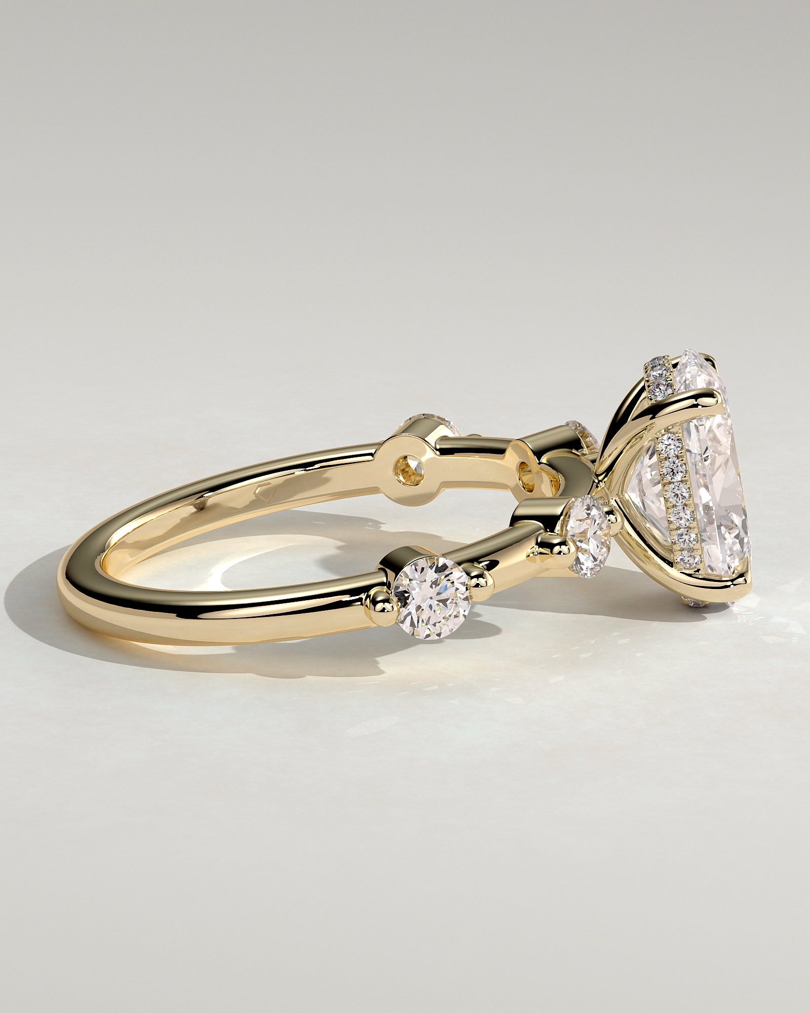 Arwen - Oval Claw Solitaire with 4 Spaced Round Accent Stones and Hidden Halo Engagement Ring - Yellow Gold - Yellow Gold 2ct