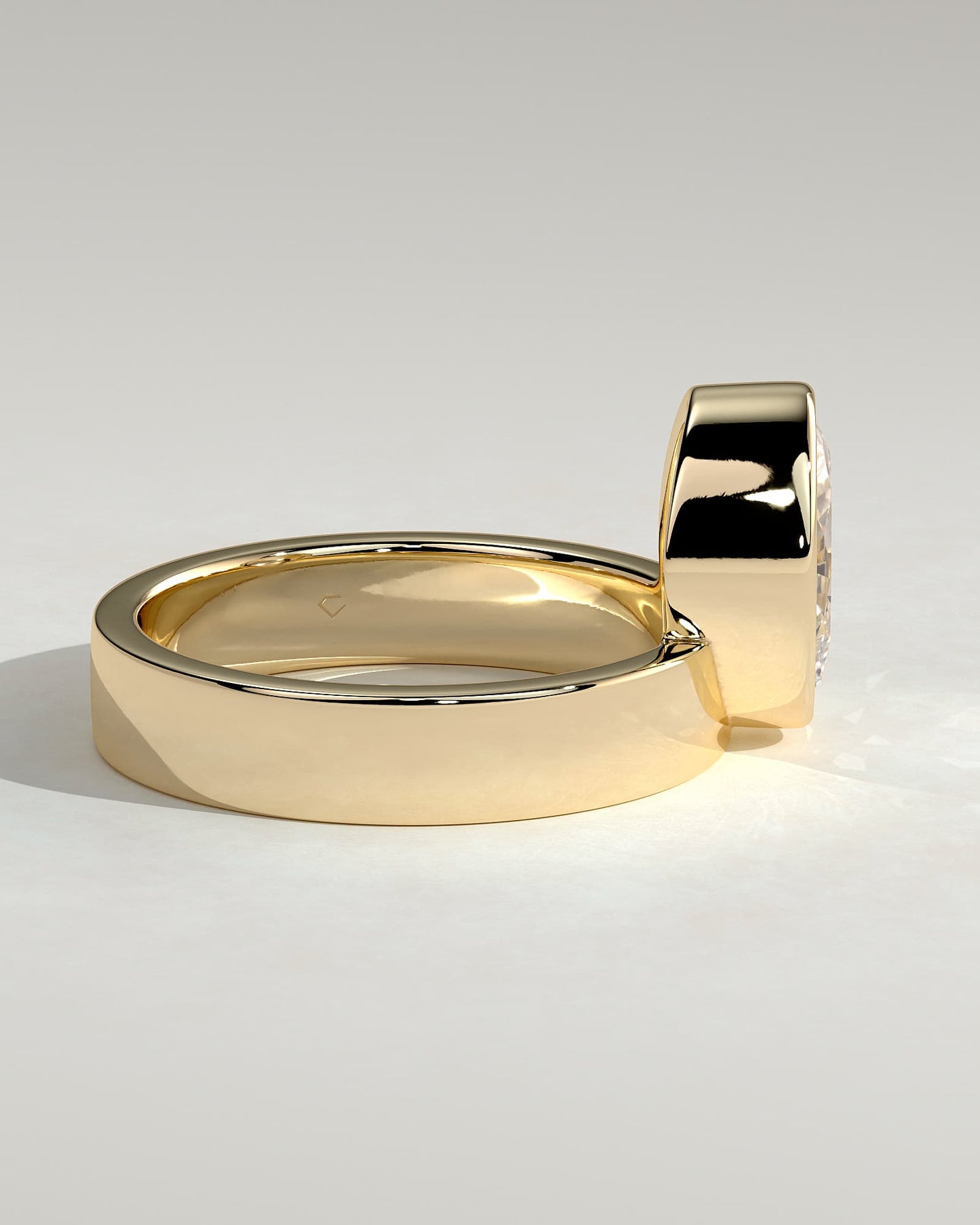 Carmen - Oval Bezel Solitaire with Offset Setting and Flat Cigar Band Engagement Ring - Yellow Gold