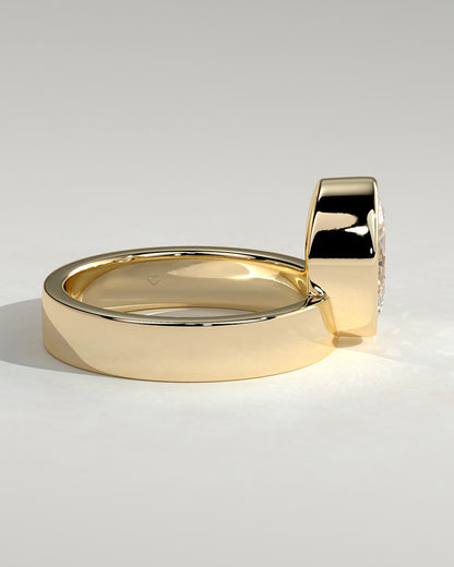 Carmen - Oval Bezel Solitaire with Offset Setting and Flat Cigar Band Engagement Ring - Yellow Gold