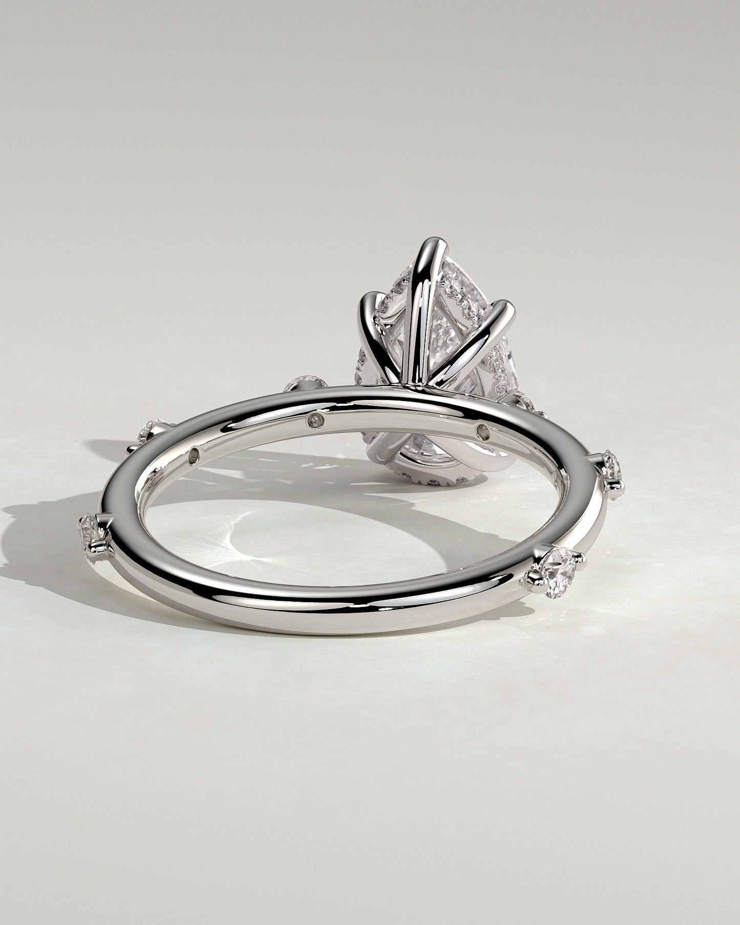 Amora - Pear Claw Solitaire with 6 Spaced Round Accent Stones and Hidden Halo Engagement Ring - Platinum - White Gold / Platinum 2ct