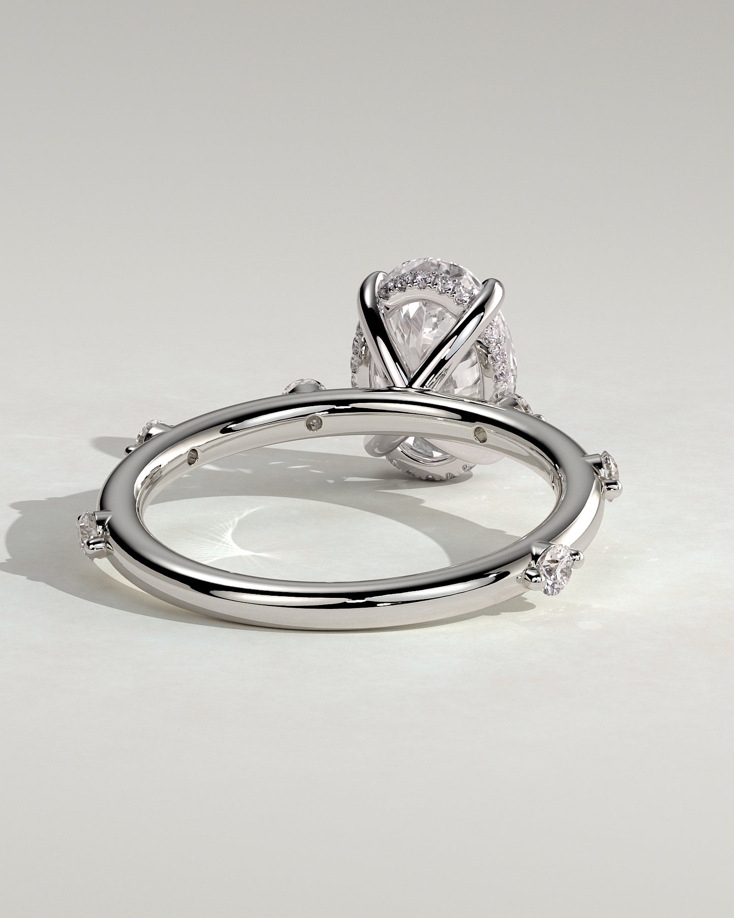 Elise - Oval Claw Solitaire with 6 Spaced Round Accent Stones and Hidden Halo Engagement Ring - Platinum - White Gold / Platinum 2ct