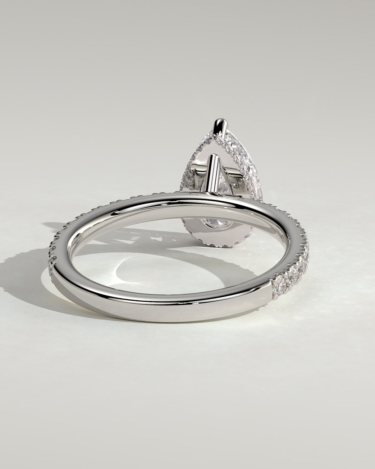 Keira - Pear Claw Solitaire with Wrap Around Hidden Halo and Pave Band Engagement Ring - White Gold