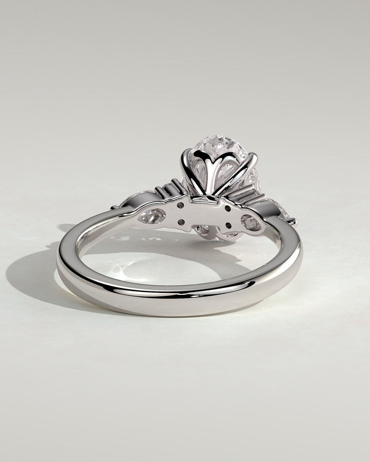 Sheridan - Oval Claw Solitaire with Pear Accents and Round Shoulder Stones Engagement Ring - Platinum