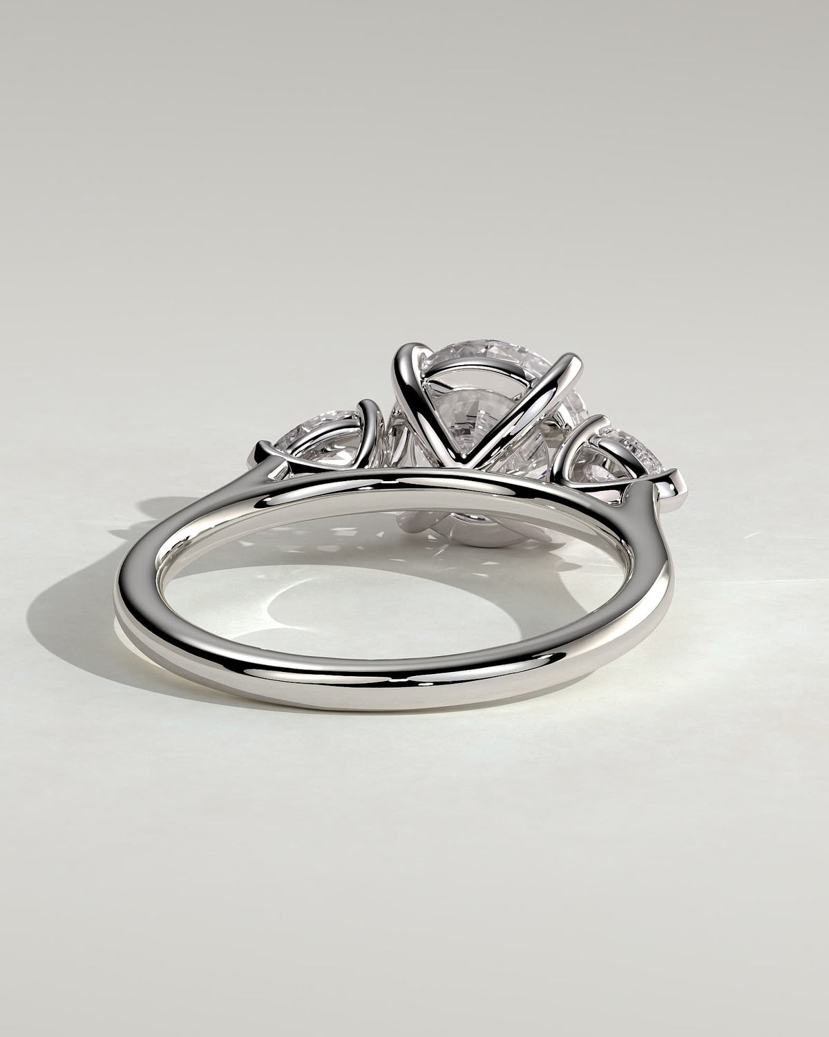 Arya - Round Claw Trilogy with Pear Side Stones and Cathedral Setting Engagement Ring - White Gold