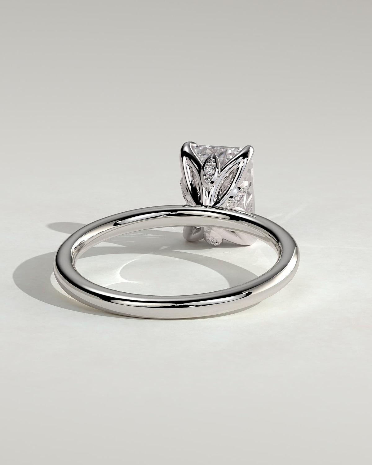 Dove - Emerald Claw Solitaire with Petal Gallery and Accent Leaf Detail Engagement Ring - White Gold