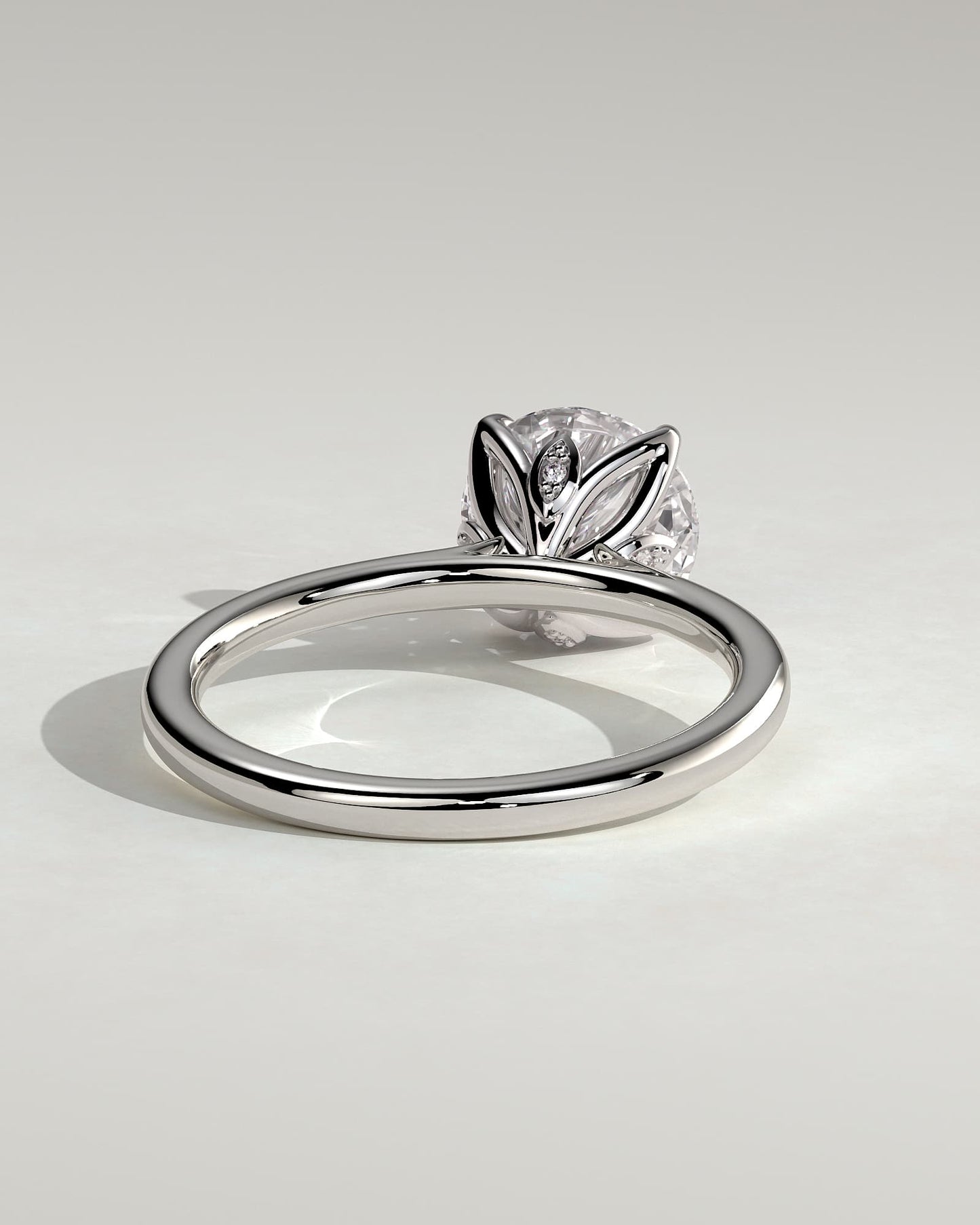Brianna - Round Claw Solitaire with Petal Gallery, Accent Leaf Detail and Cathedral Setting Engagement Ring - Platinum