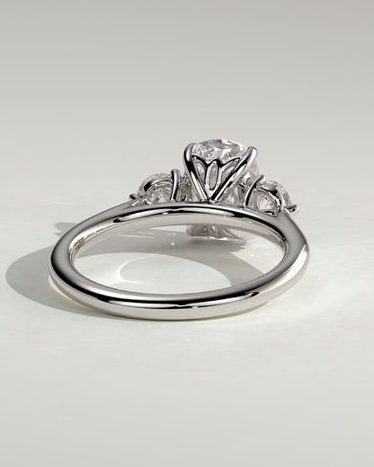 Charmaine - Elongated Cushion Claw Trilogy with Round Side Stones and Lily Detail Engagement Ring - White Gold