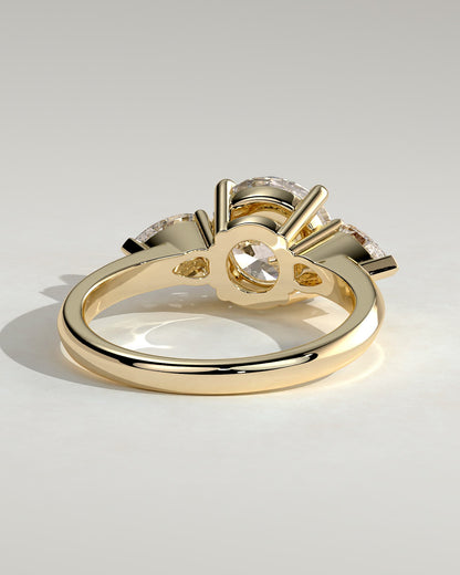 Halle - Round Claw Trilogy with Pear Side Stones and Knife Edge Band Engagement Ring - Yellow Gold