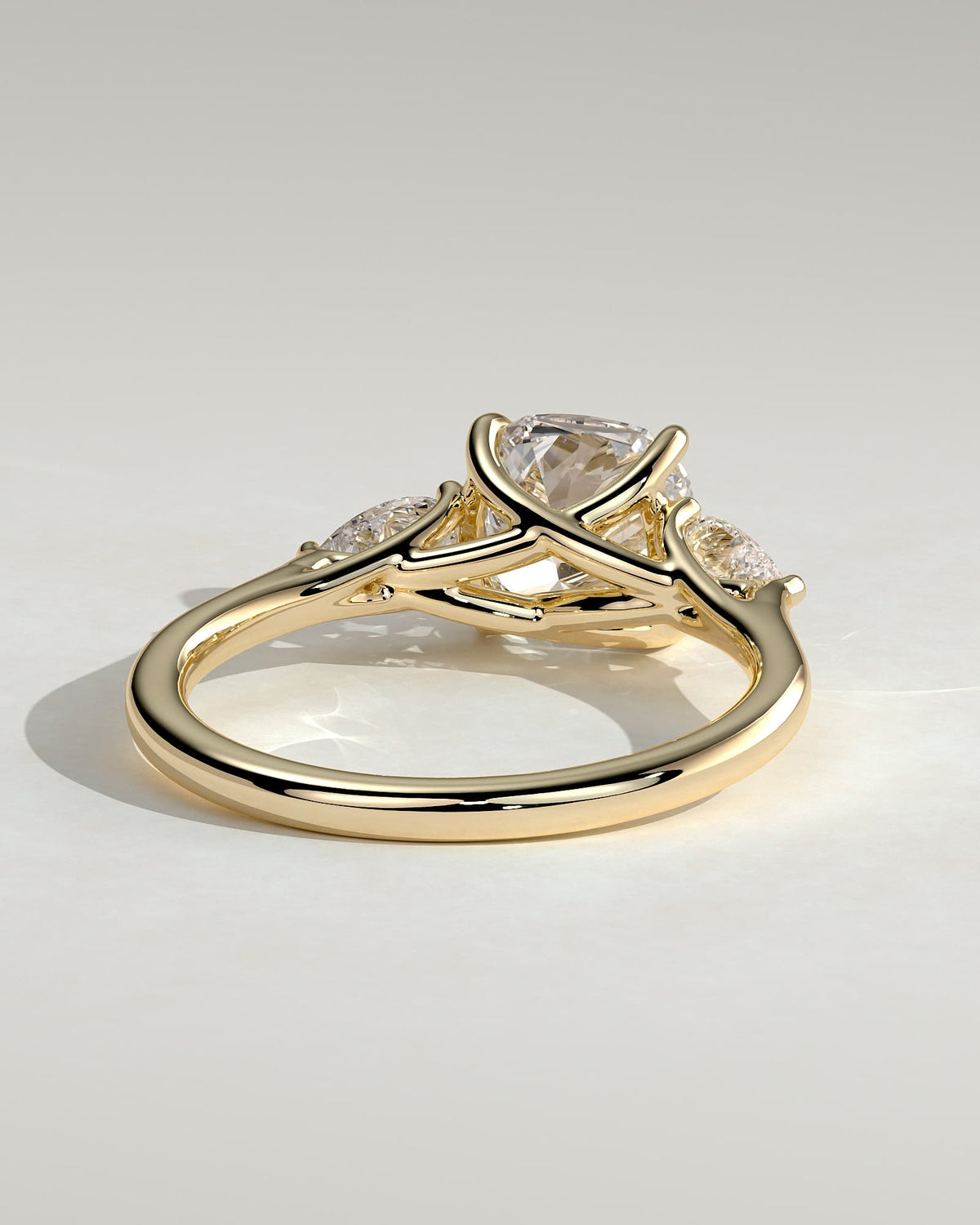 Selena - Cushion Claw Trilogy with Pear Side Stones and Open Trellis Gallery Engagement Ring - Yellow Gold