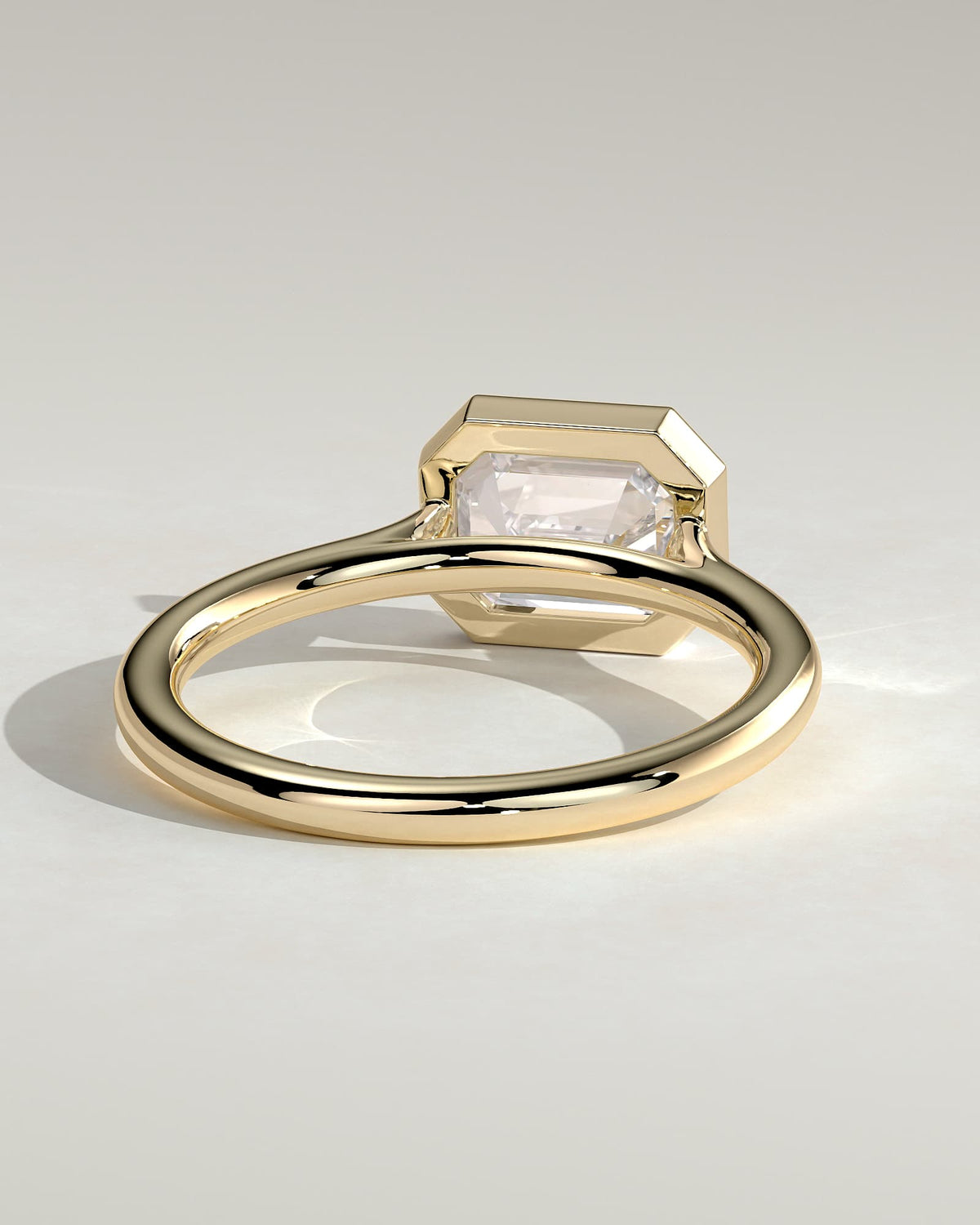 Olive - Statement Emerald East West Bezel Solitaire with Open Cathedral High Setting Engagement Ring - Yellow Gold