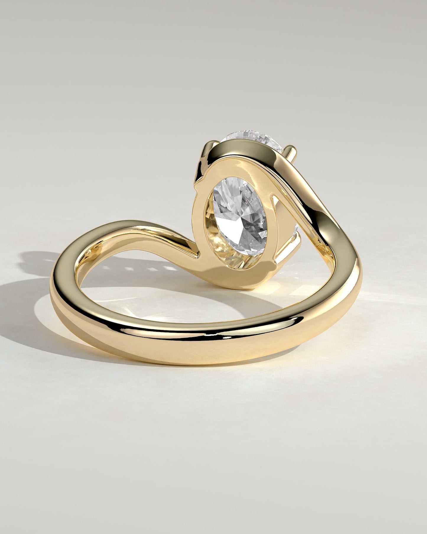 Kala - Oval Claw Solitaire with Bypass Band Engagement Ring - Yellow Gold