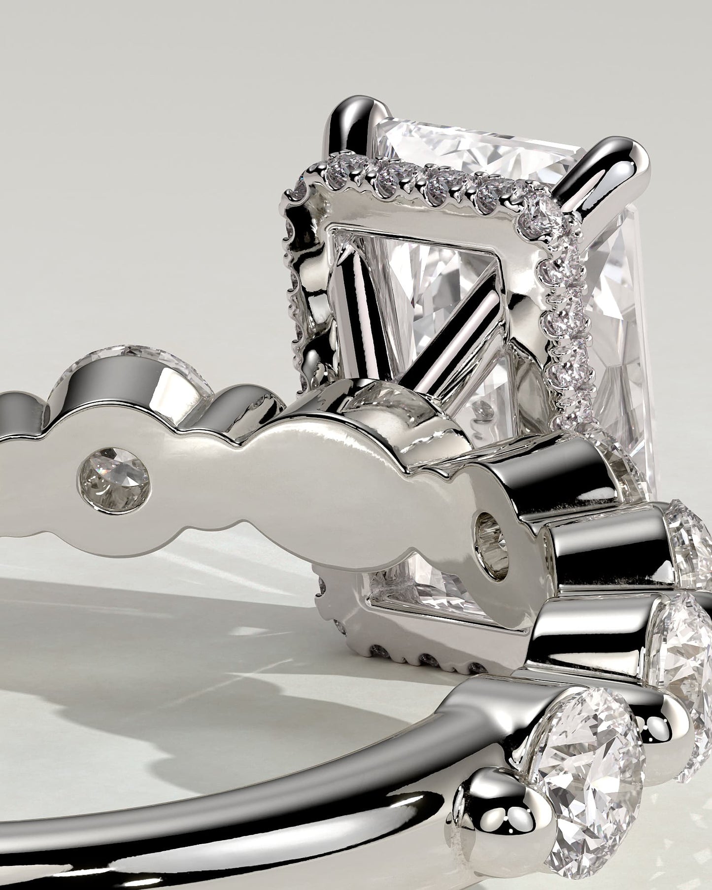 Josephine - Radiant Claw Solitaire with Round Accent Stones and Wrap Around Hidden Halo Engagement Ring - Platinum