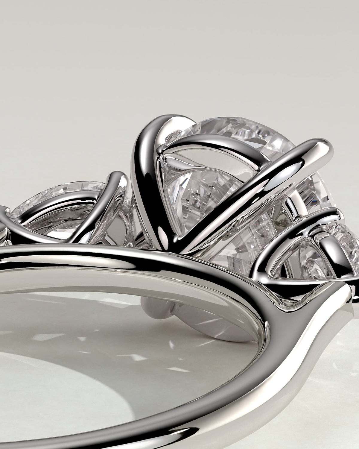 Arya - Round Claw Trilogy with Pear Side Stones and Cathedral Setting Engagement Ring - White Gold