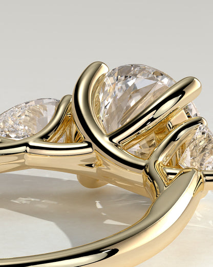 Adelyn - Round Claw Trilogy with Pear Side Stones and Open Trellis Gallery Engagement Ring - Yellow Gold
