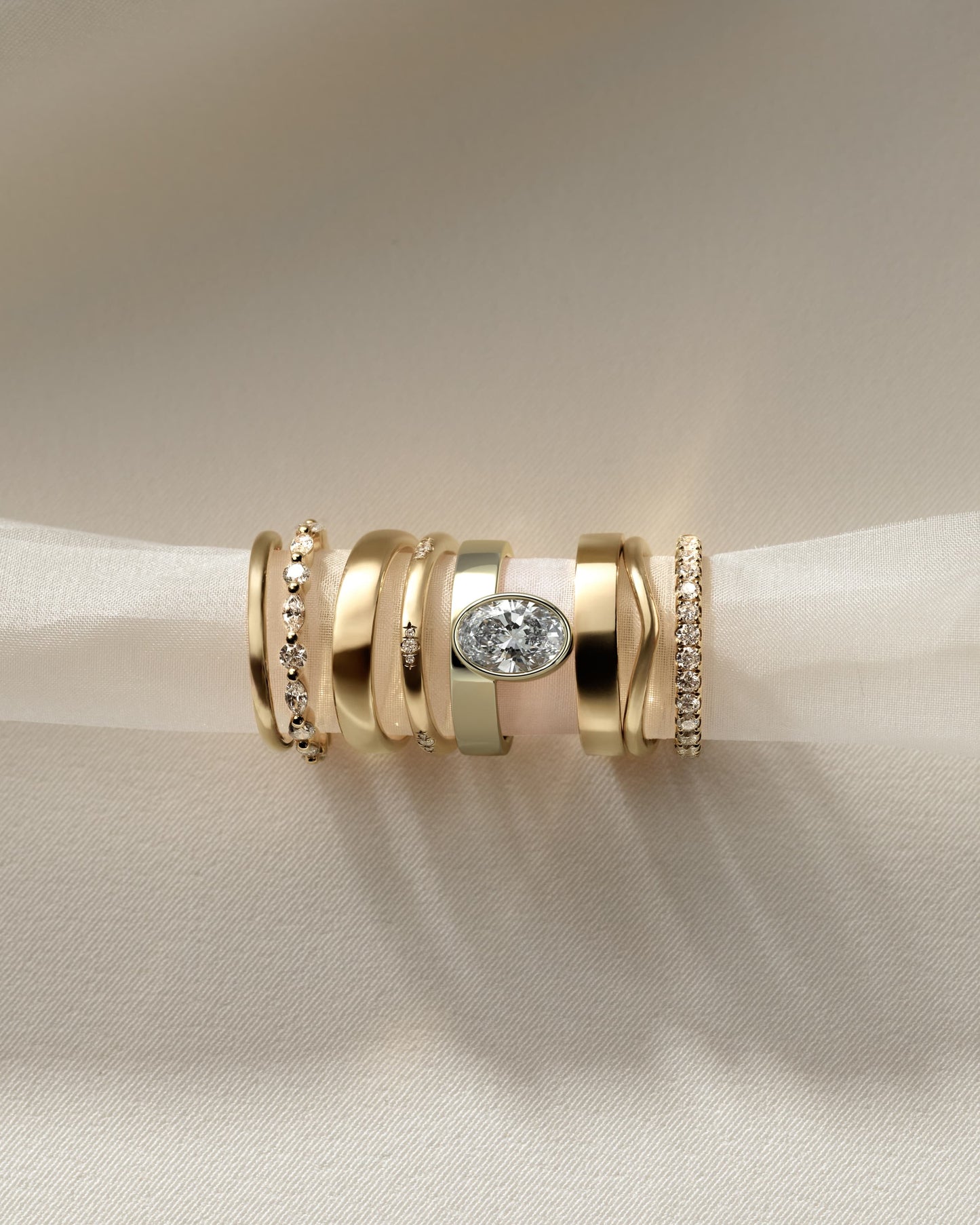 Carmen - Oval Bezel Solitaire with Offset Setting and Flat Cigar Band Engagement Ring - Yellow Gold