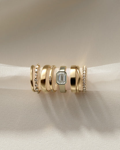 Adrian - Statement Emerald East West Bezel Solitaire with Flat Cigar Band Engagement Ring - Yellow Gold
