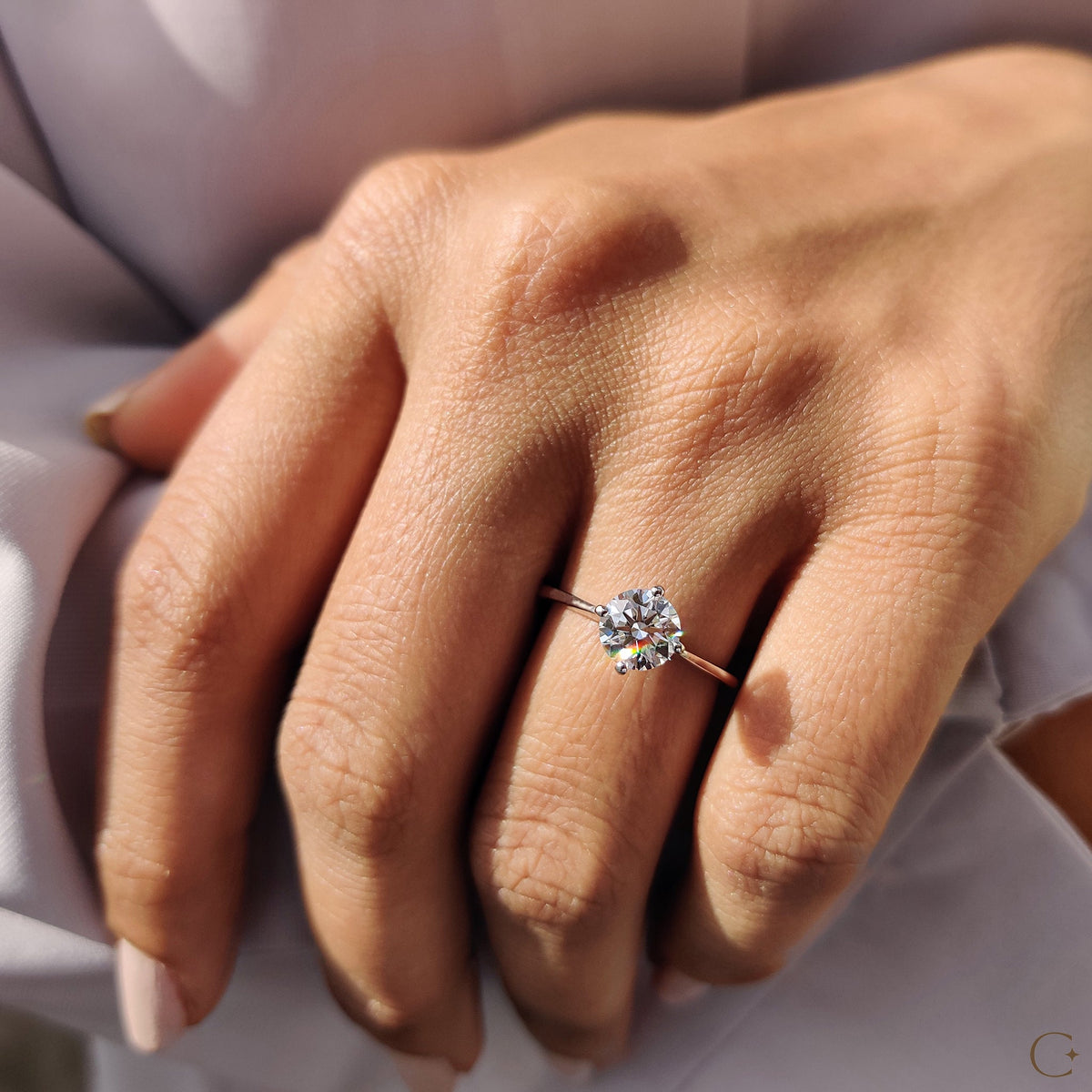 Round Solitaire Engagement Ring With Tapered Shank Design