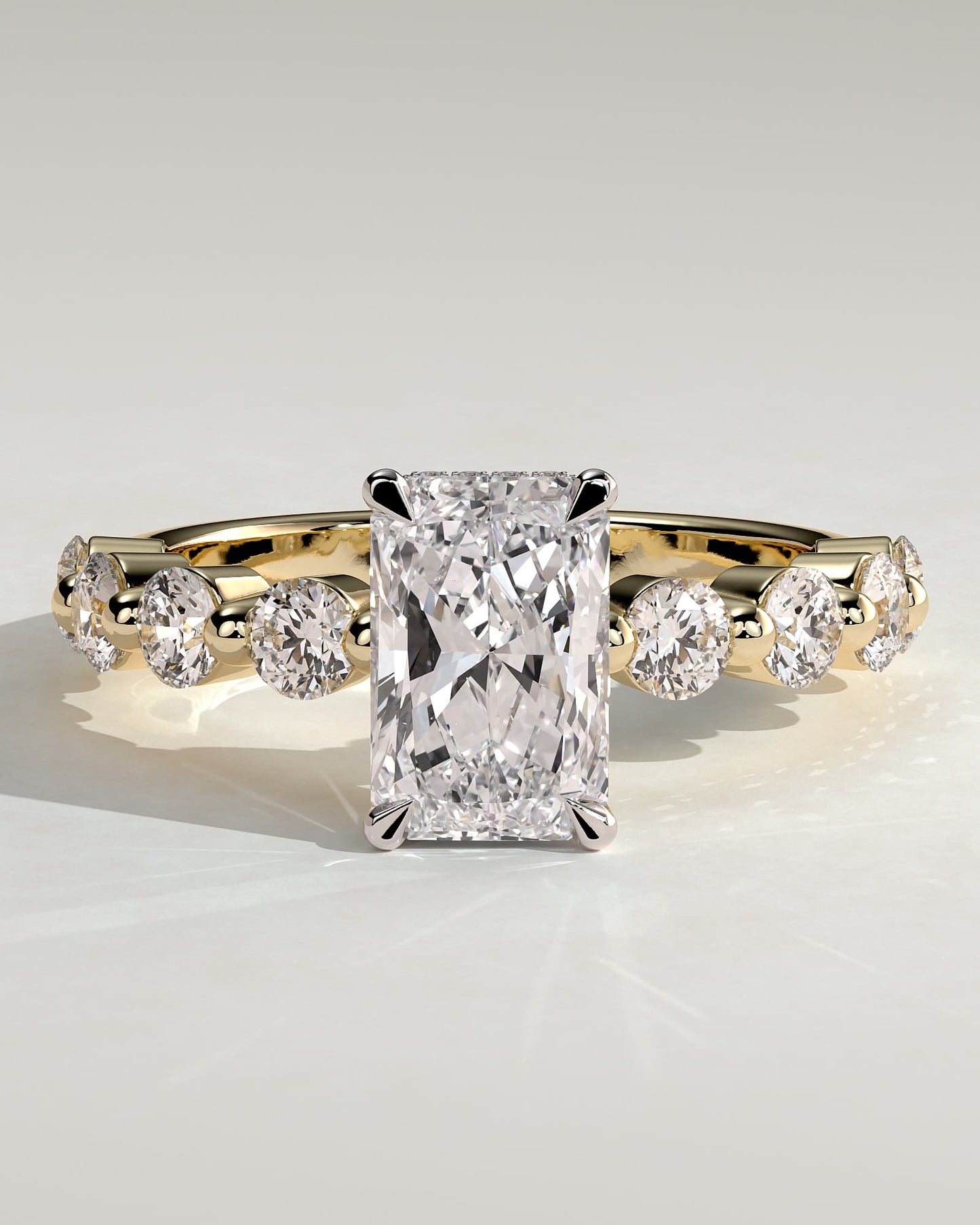 Josephine - Radiant Claw Solitaire with Round Accent Stones and Wrap Around Hidden Halo Engagement Ring - Yellow Two-Tone