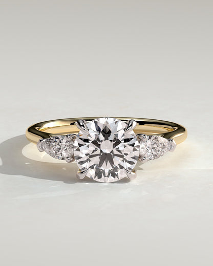 Arya - Round Claw Trilogy with Pear Side Stones and Cathedral Setting Engagement Ring - Yellow Two-Tone