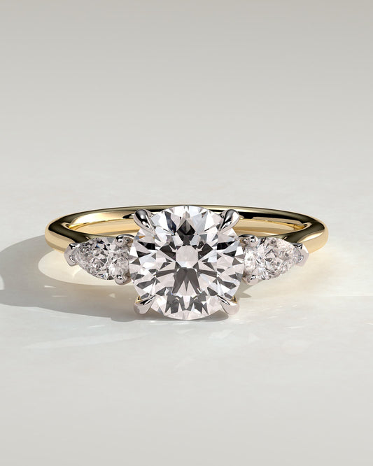 Arya - Round Claw Trilogy with Pear Side Stones and Cathedral Setting Engagement Ring - Yellow Two-Tone