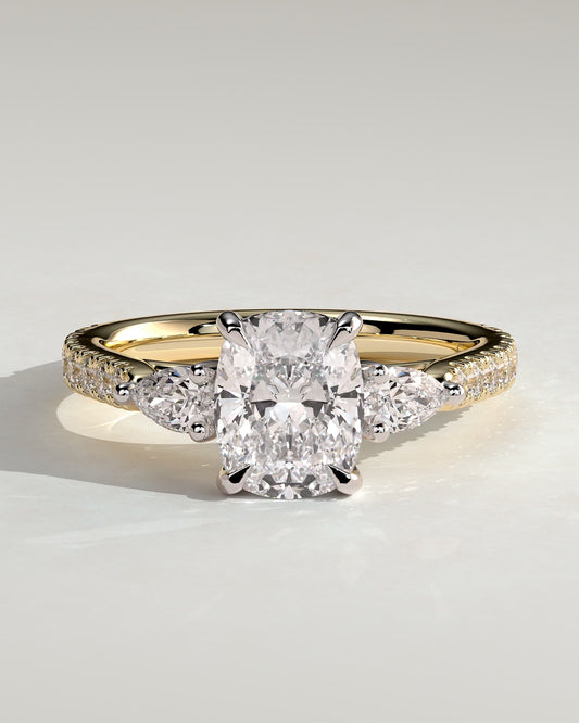 Bree - Elongated Cushion Claw Trilogy with Pear Side Stones and Pave Band Engagement Ring - Yellow Two-Tone