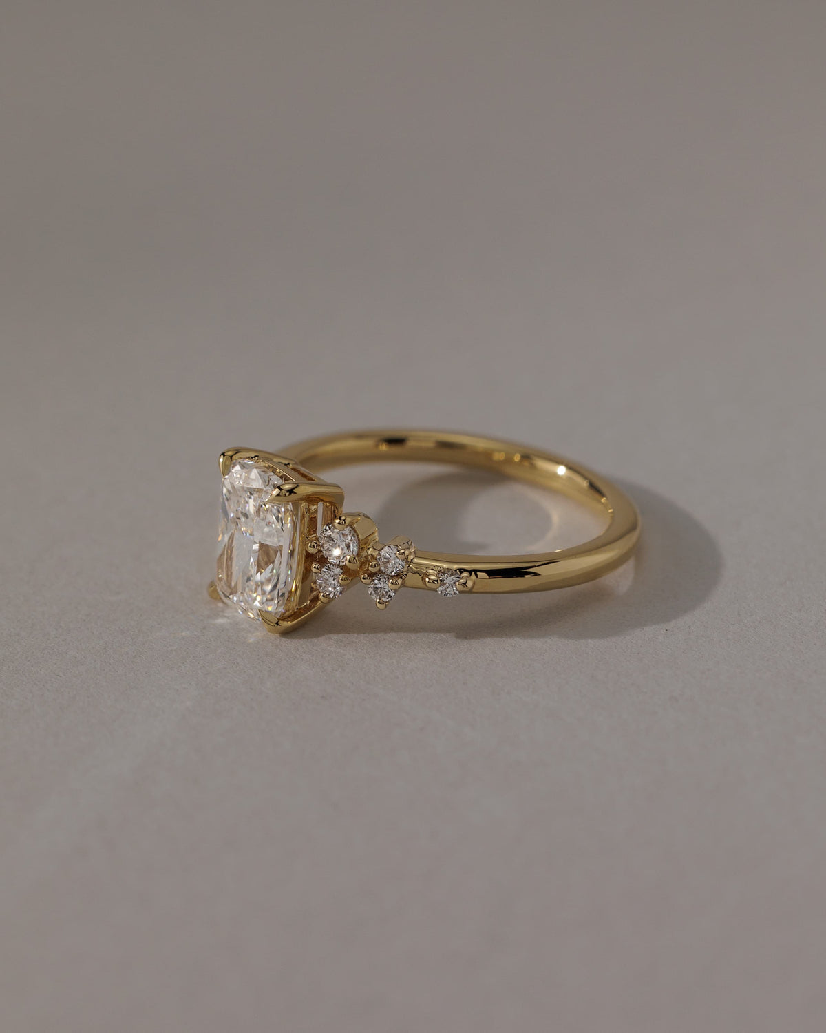 Winnie - Elongated Cushion Claw Solitaire with Clustered Round Shoulder Stones Engagement Ring - Platinum
