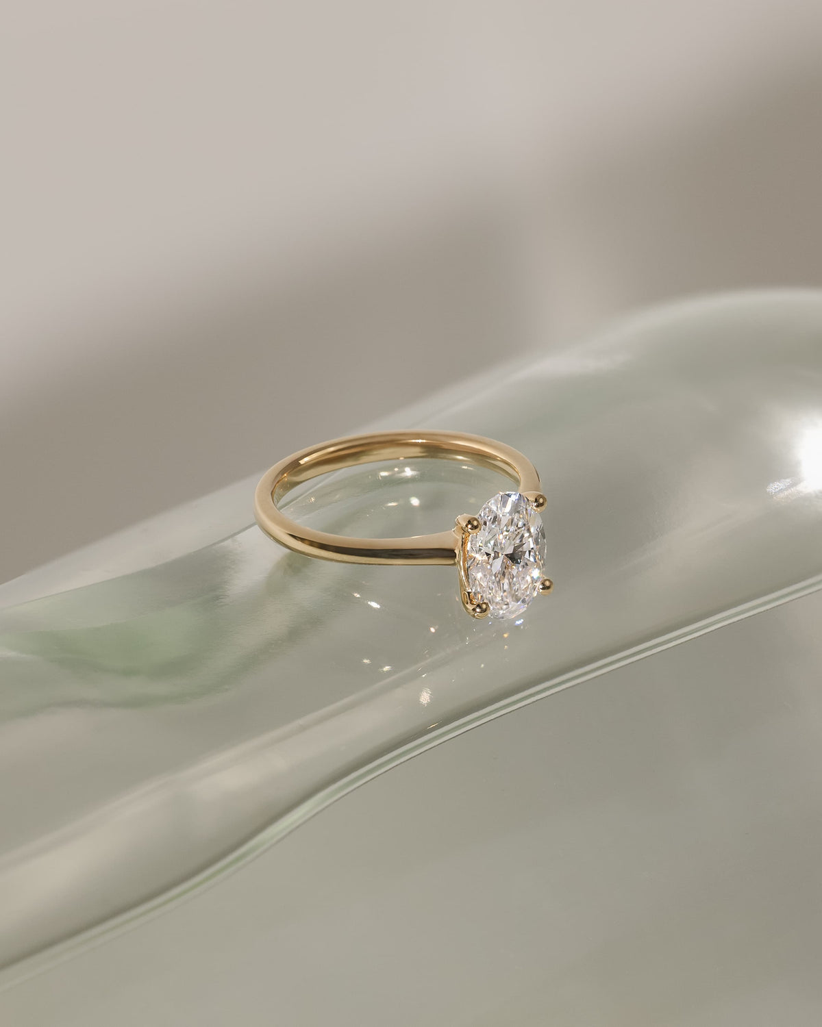 Emily - Oval Claw Solitaire with Pinched Tapered Band and Cathedral Low Setting Engagement Ring - Yellow Gold
