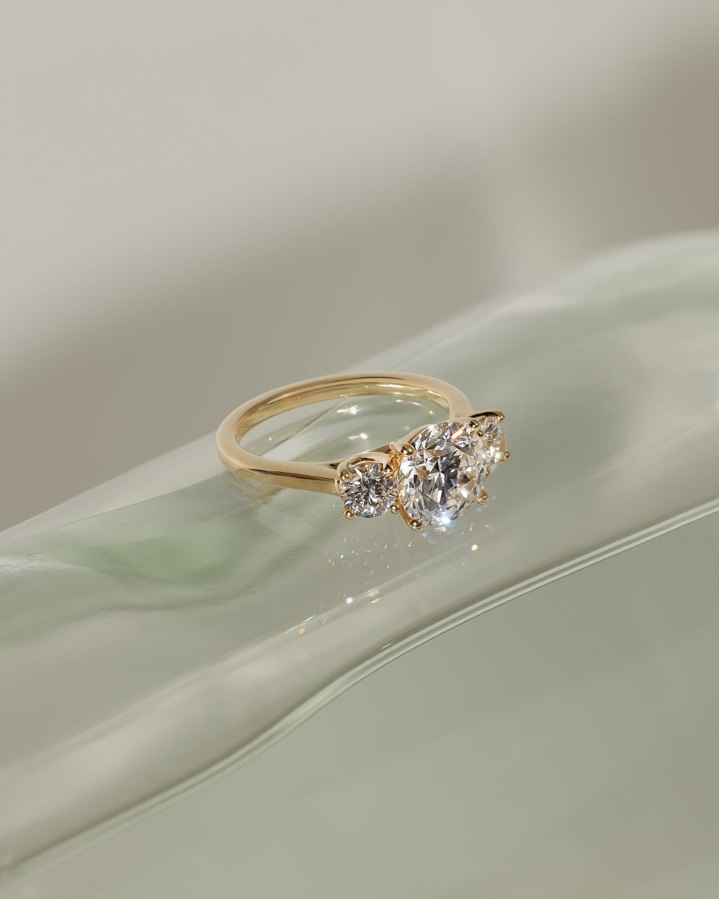 Octavia - Round Claw Trilogy with Round Side Stones and Trellis Gallery Engagement Ring - Platinum