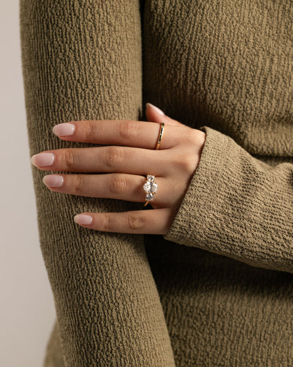 Grace - Oval Claw Trilogy with Round Side Stones, Open Trellis Gallery and Tapered Band Engagement Ring - Yellow Gold