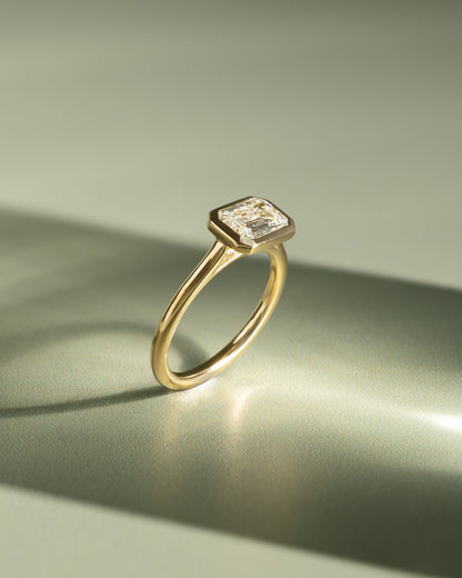 Olive - Statement Emerald East West Bezel Solitaire with Open Cathedral High Setting Engagement Ring - Yellow Gold