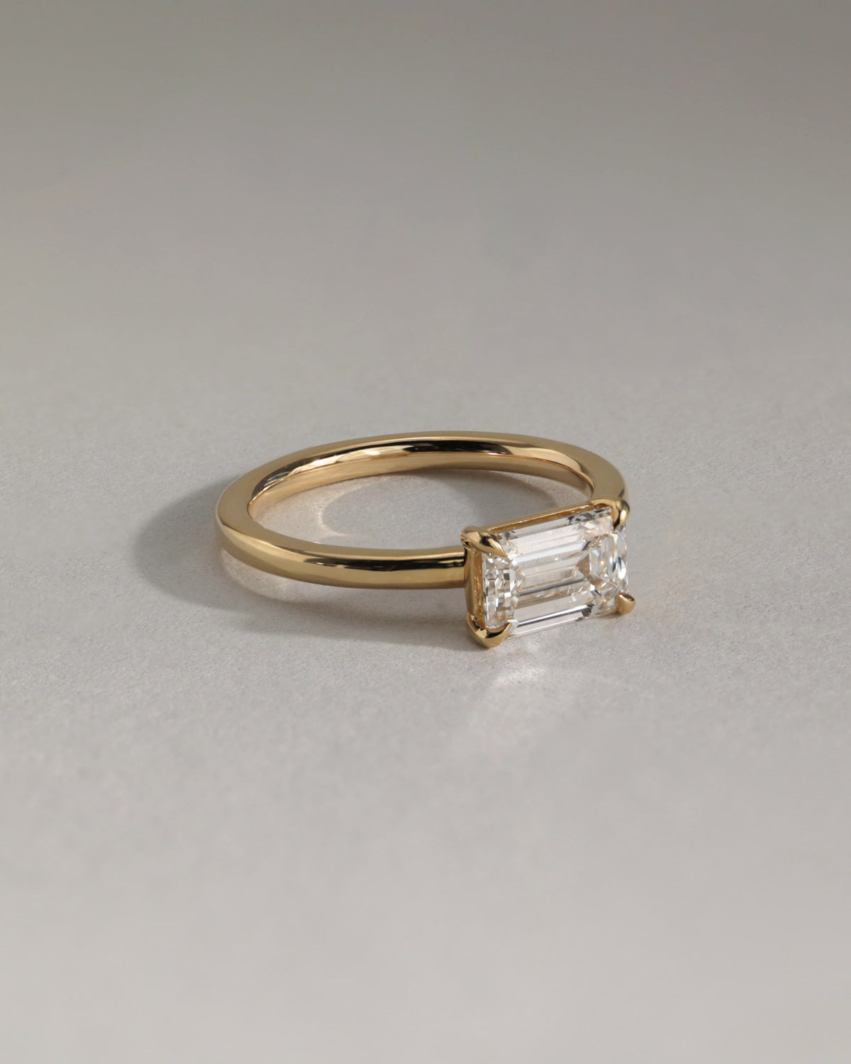 Evelyn - Emerald East West Claw Solitaire with Raised Basket Gallery Engagement Ring - Rose Gold