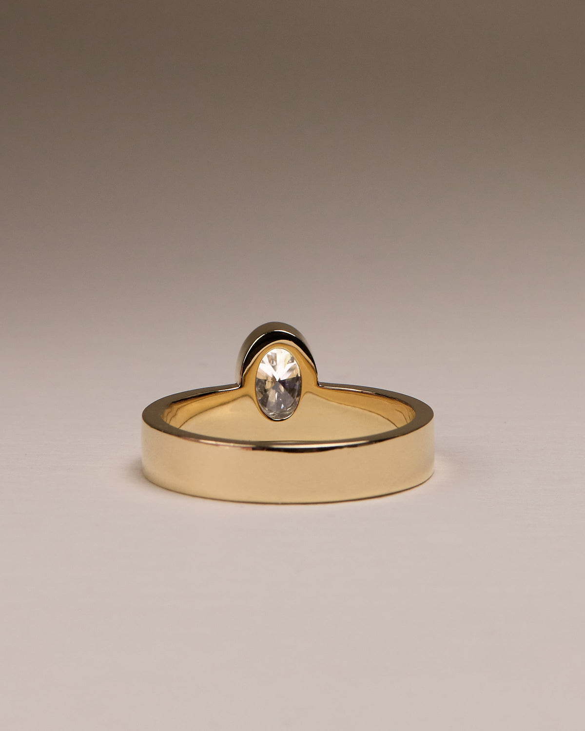 Carmen - Oval Bezel Solitaire with Offset Setting and Flat Cigar Band Engagement Ring - Platinum