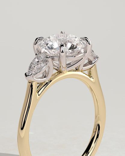 Arya - Round Claw Trilogy with Pear Side Stones and Cathedral Setting Engagement Ring - Yellow Two-Tone