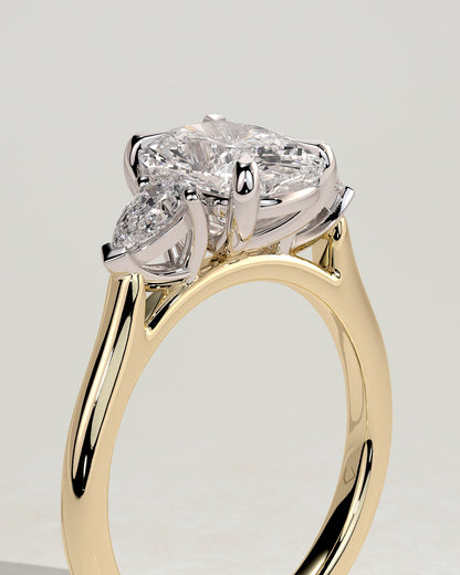 Cataleya - Elongated Cushion Claw Trilogy with Pear Side Stones and Cathedral Setting Engagement Ring - Yellow Two-Tone