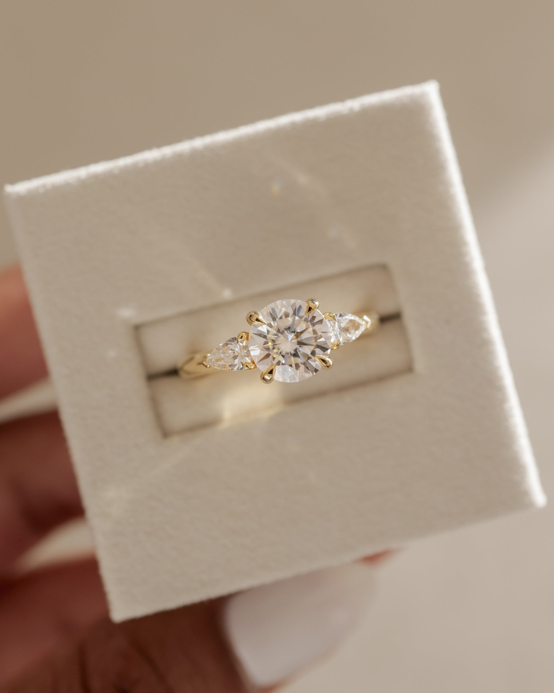 Halle - Round Claw Trilogy with Pear Side Stones and Knife Edge Band Engagement Ring - Platinum - Lifestyle