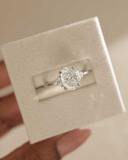 Sharon - Oval Claw Solitaire with Round Shoulder Stones Engagement Ring - Platinum