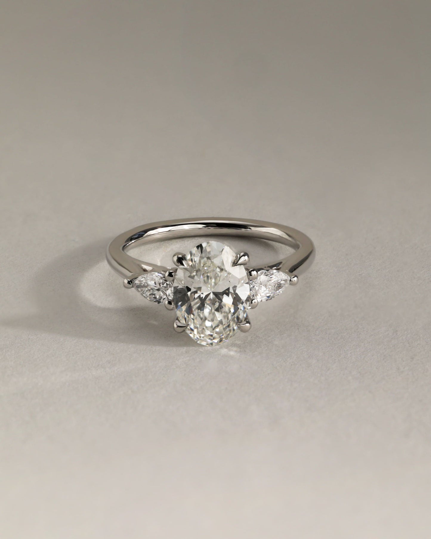 Amara - Oval Claw Trilogy with Pear Side Stones and Open Trellis Gallery Engagement Ring - Yellow Gold - yellow gold - Lara Jewels