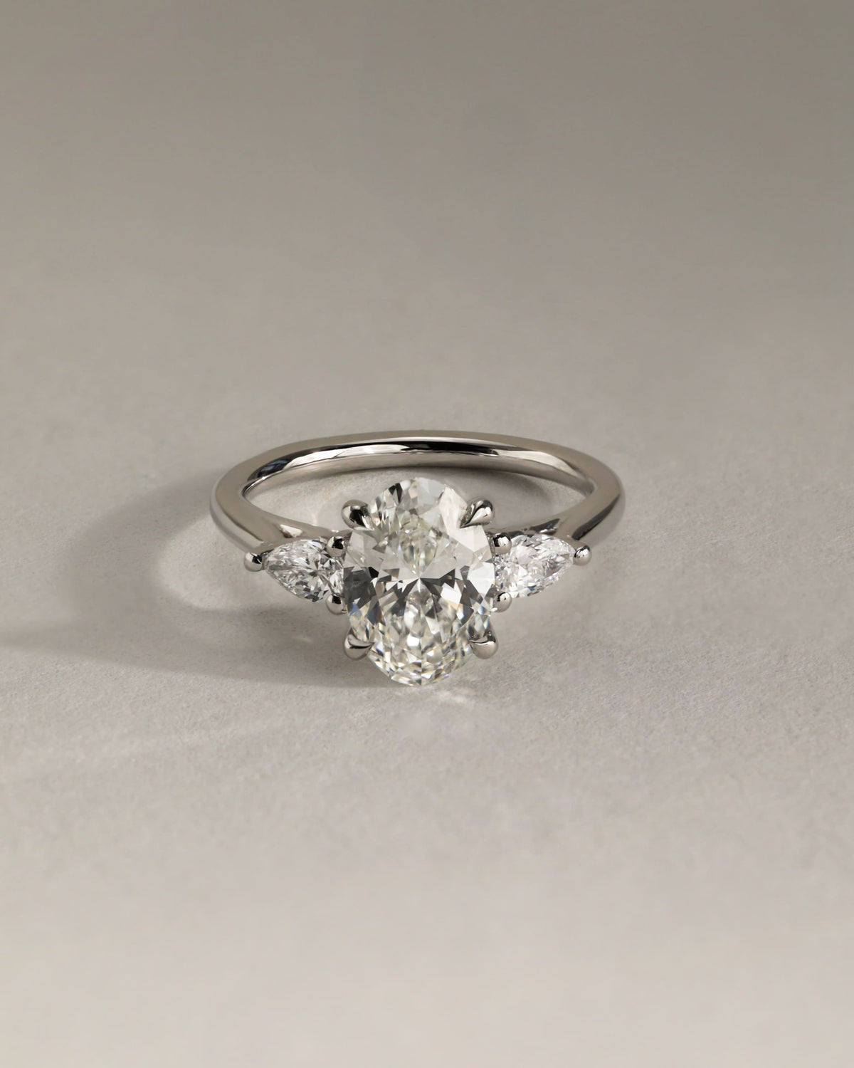 Amara - Oval Claw Trilogy with Pear Side Stones and Open Trellis Gallery Engagement Ring - Yellow Gold - yellow gold - Lara Jewels