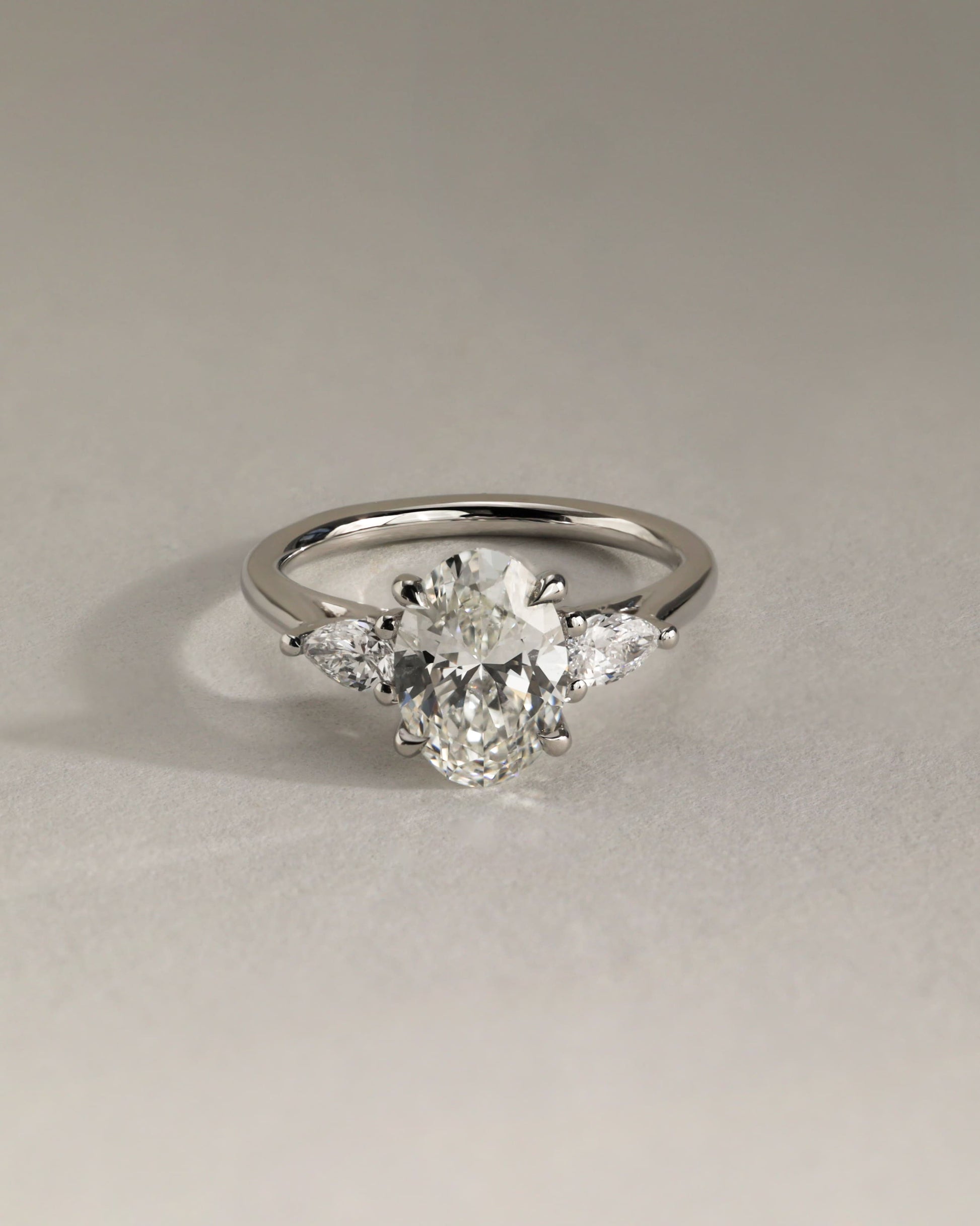 Amara - Oval Claw Trilogy with Pear Side Stones and Open Trellis Gallery Engagement Ring - White Gold - white gold - Lara Jewels