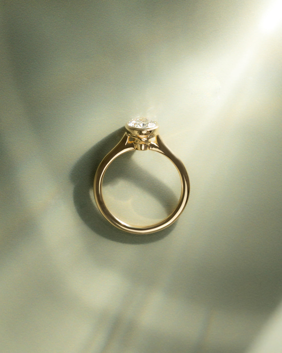 Gemma - Oval Bezel Solitaire with Twisted Gallery Engagement Ring - Yellow Gold