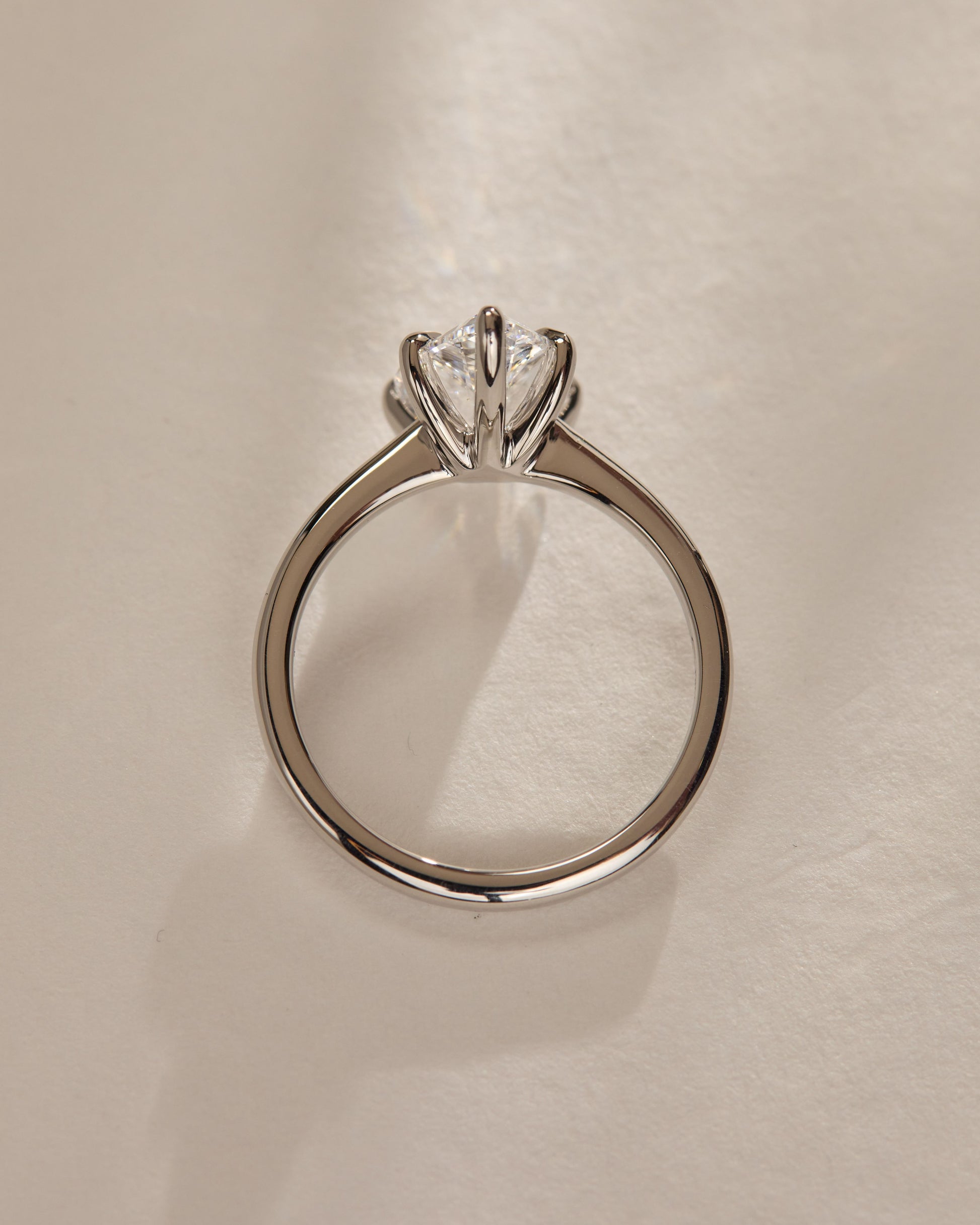 Aspen - Pear Claw Solitaire with Pinched Tapered Band and Cathedral Low Setting Engagement Ring - Platinum - Lifestyle