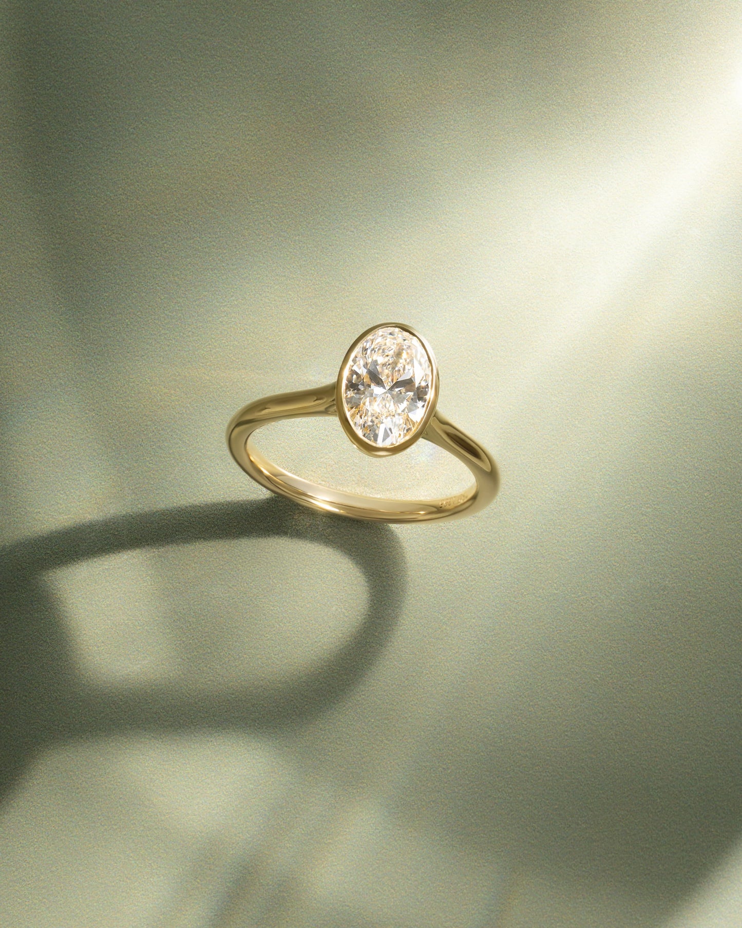Gemma - Oval Bezel Solitaire with Twisted Gallery Engagement Ring - Yellow Gold