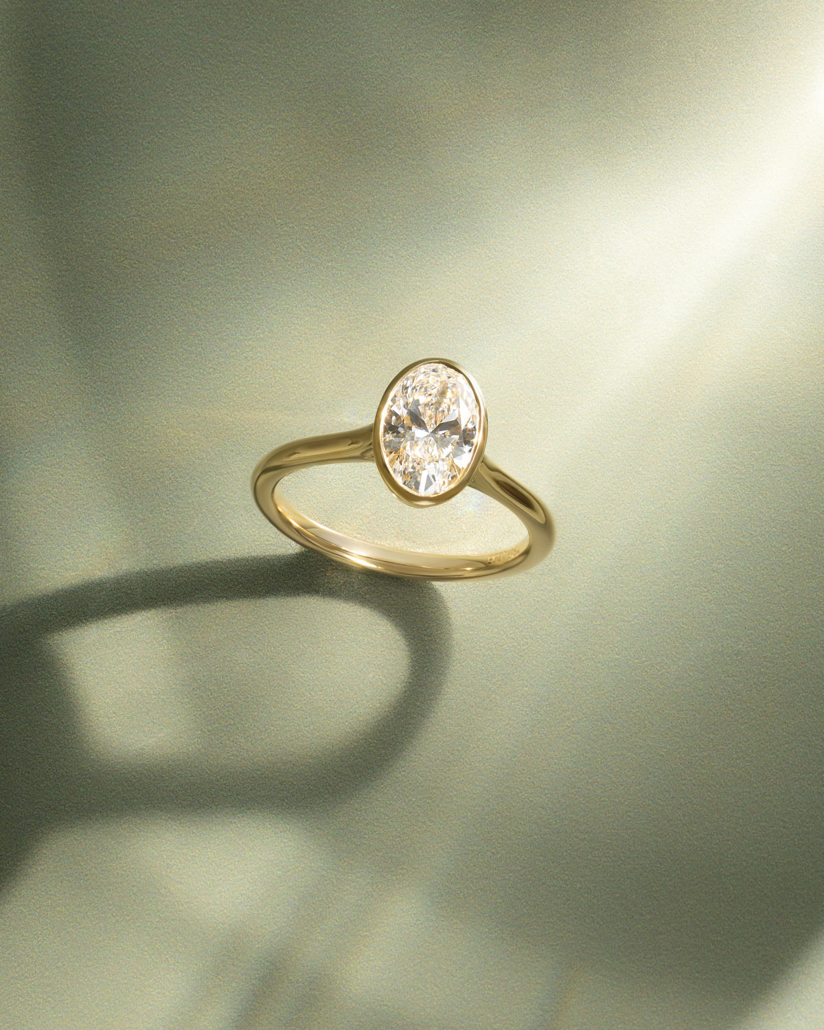Gemma - Oval Bezel Solitaire with Twisted Gallery Engagement Ring - Platinum