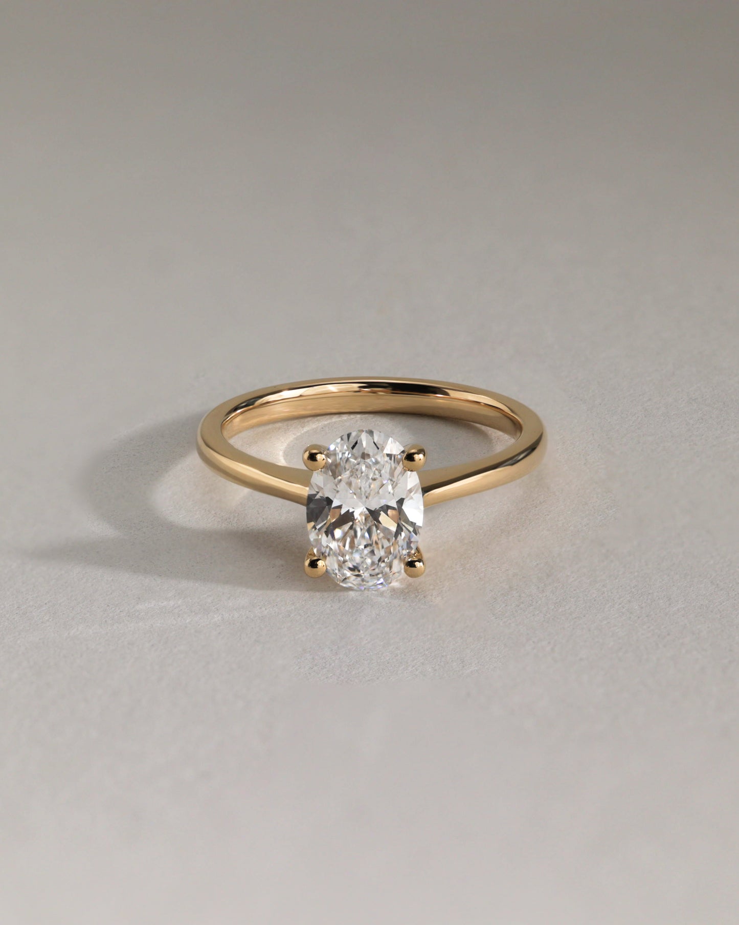 Emily - Oval Claw Solitaire with Pinched Tapered Band and Cathedral Low Setting Engagement Ring - Platinum - Lifestyle