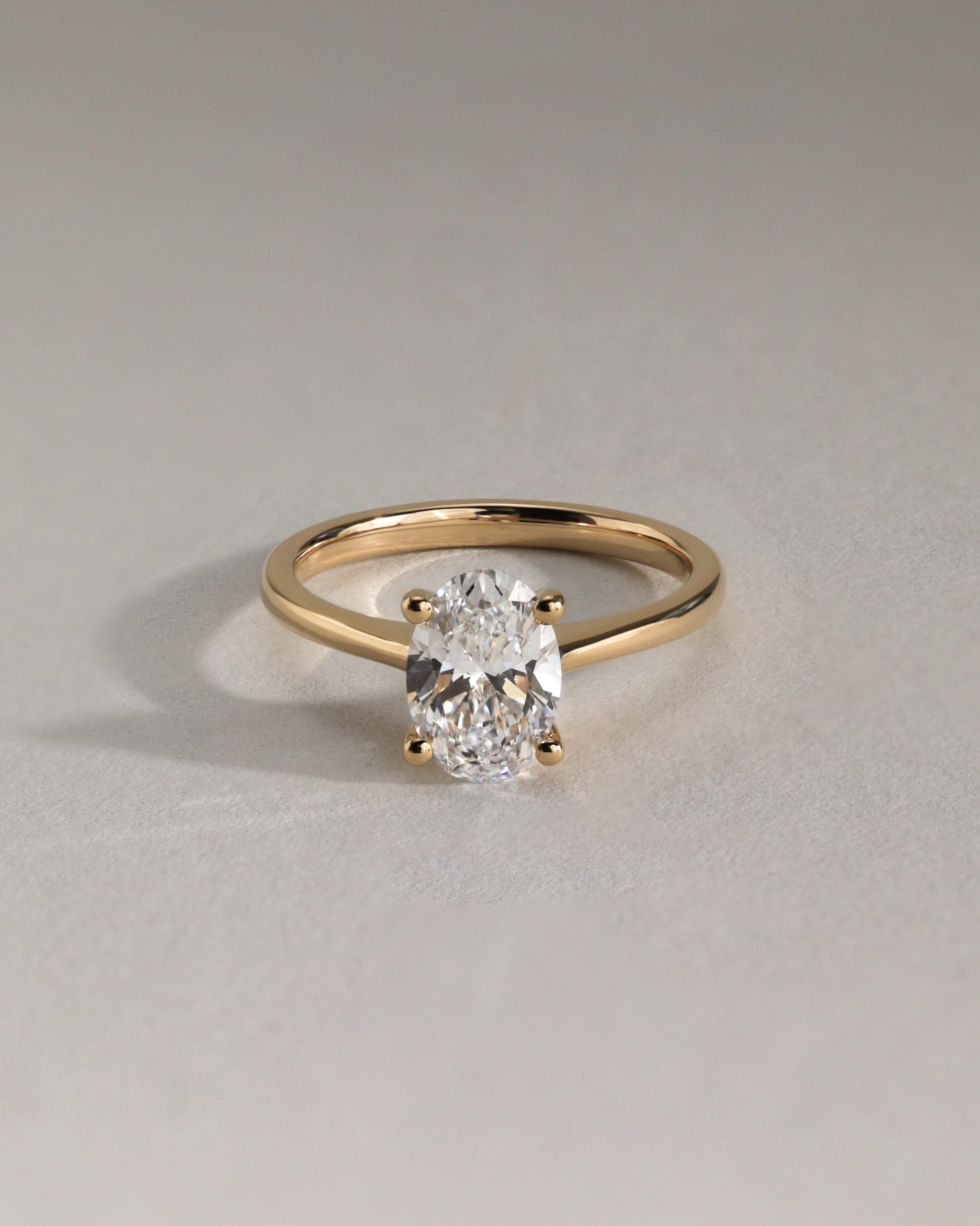 Emily - Oval Claw Solitaire with Pinched Tapered Band and Cathedral Low Setting Engagement Ring - Platinum - Lifestyle