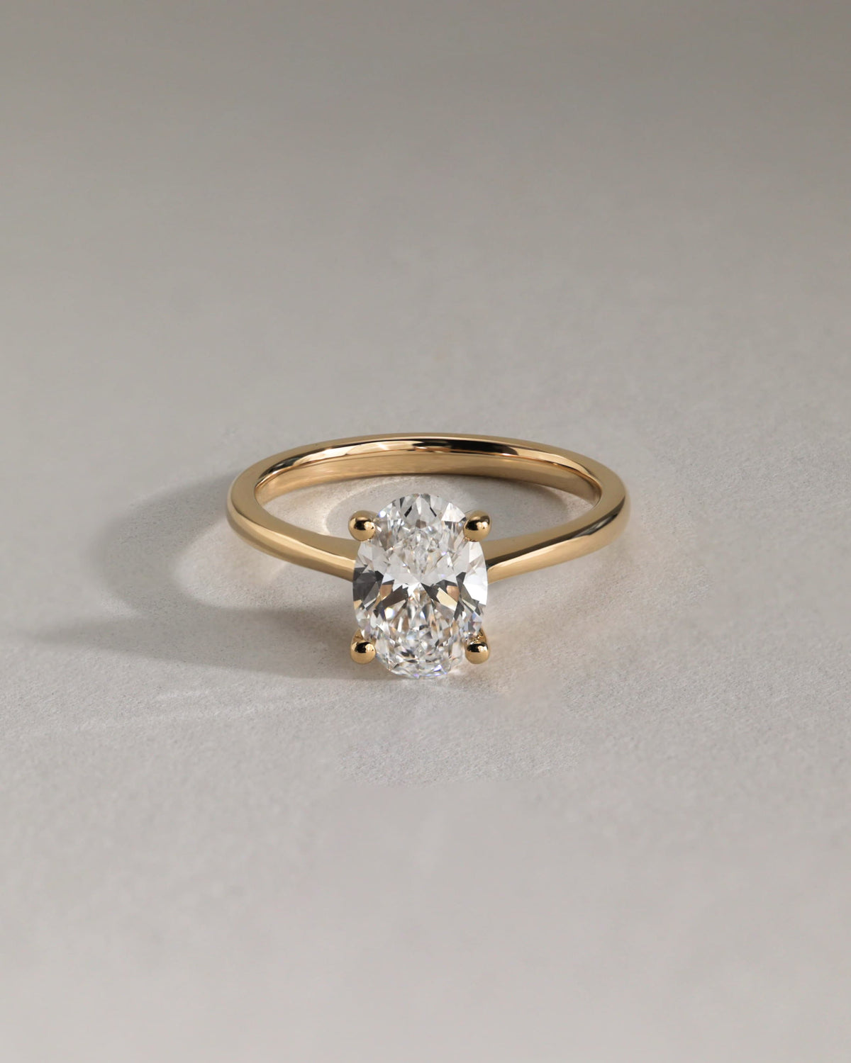 Emily - Oval Claw Solitaire with Pinched Tapered Band and Cathedral Low Setting Engagement Ring - Rose Gold