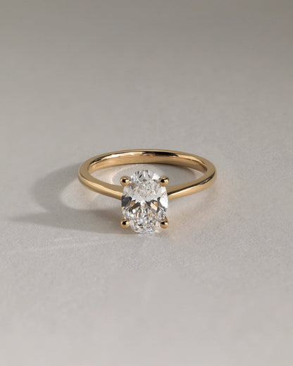 Emily - Oval Claw Solitaire with Pinched Tapered Band and Cathedral Low Setting Engagement Ring - Yellow Gold