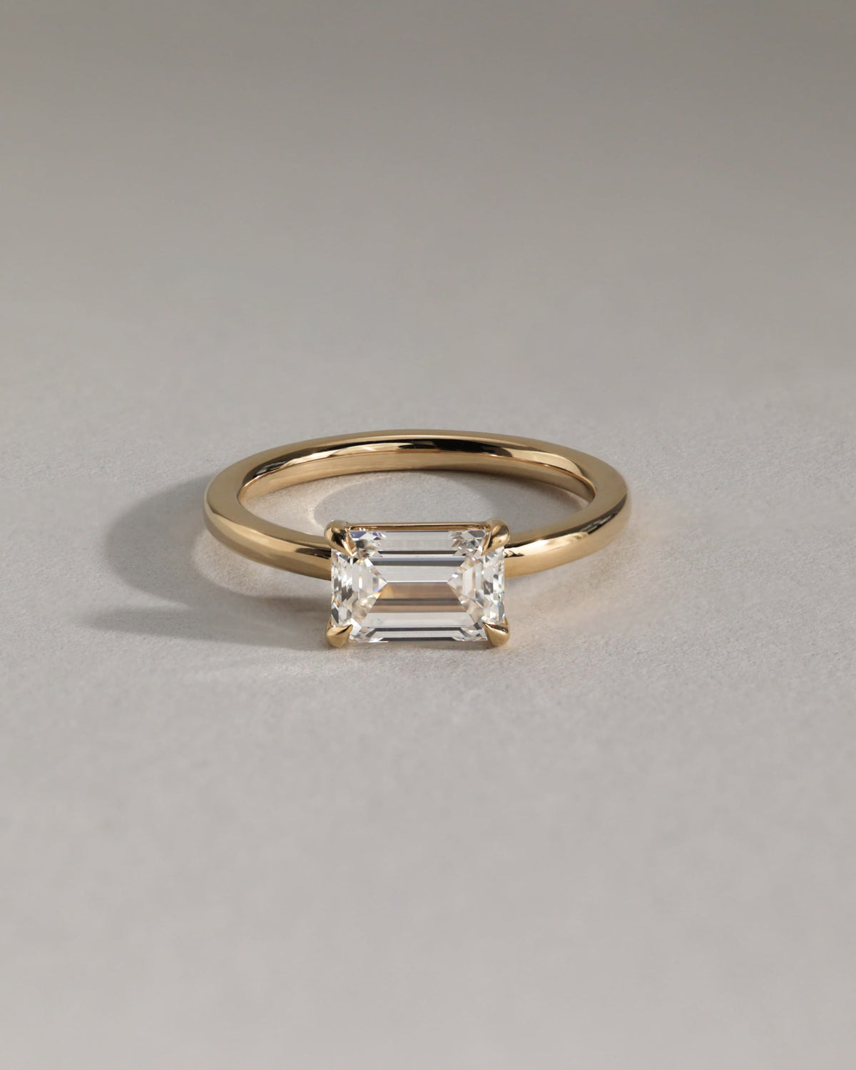 Evelyn - Emerald East West Claw Solitaire with Raised Basket Gallery Engagement Ring - Rose Gold
