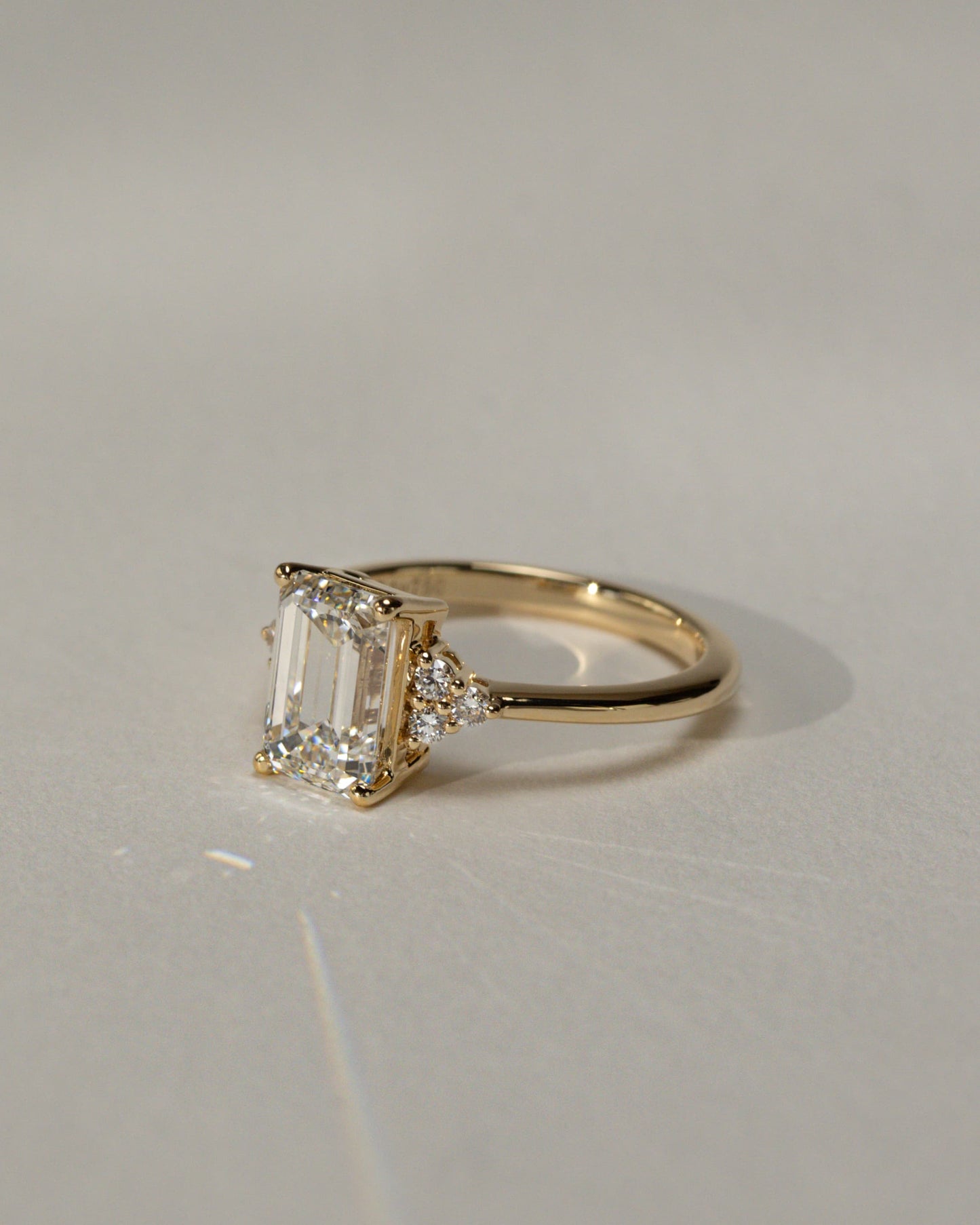 Martina - Emerald Claw Solitaire with Round Shoulder Stones Engagement Ring - Rose Gold