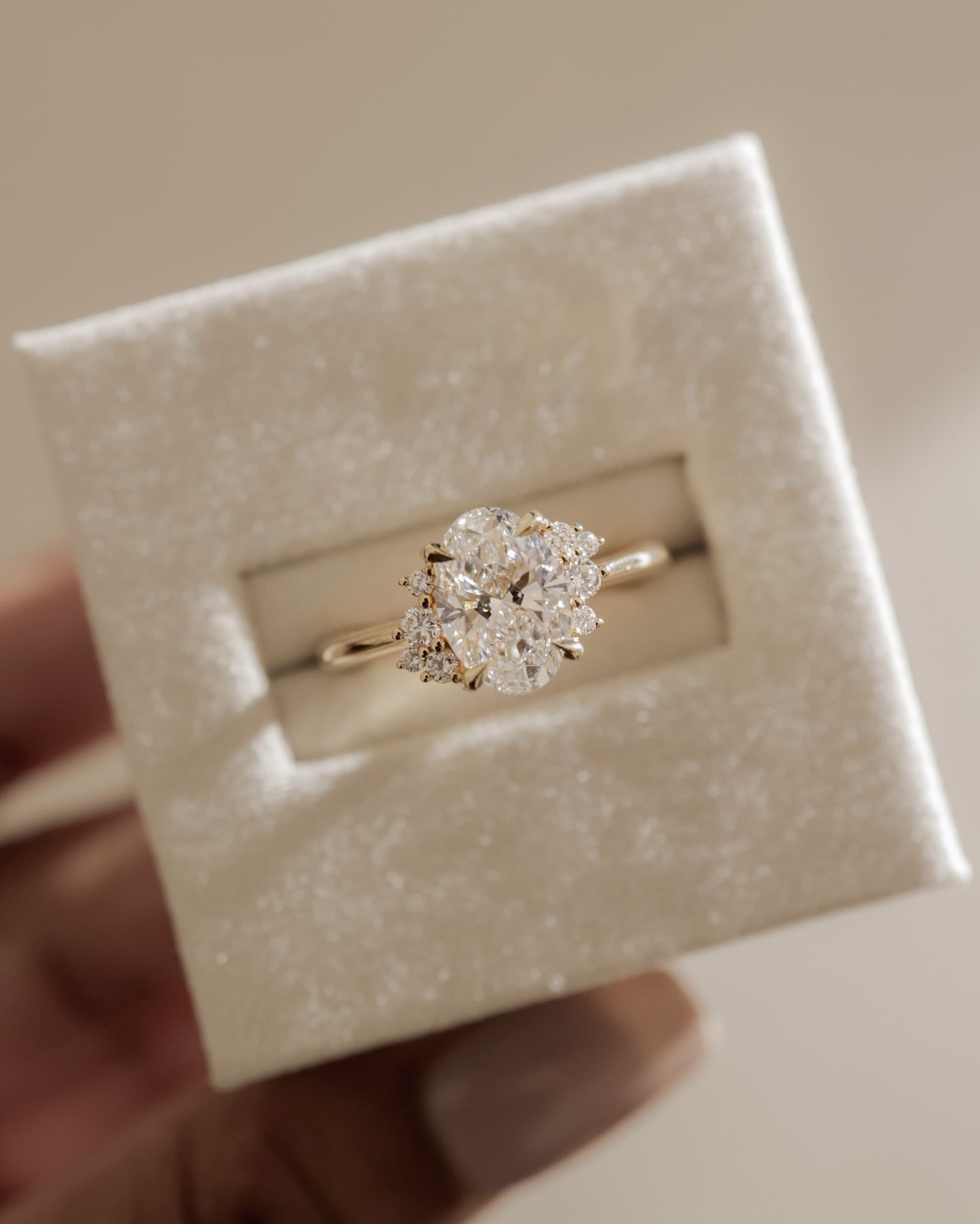 Esther - Oval Claw Solitaire with Clustered Round Opposing Shoulder Stones Engagement Ring - Yellow Gold